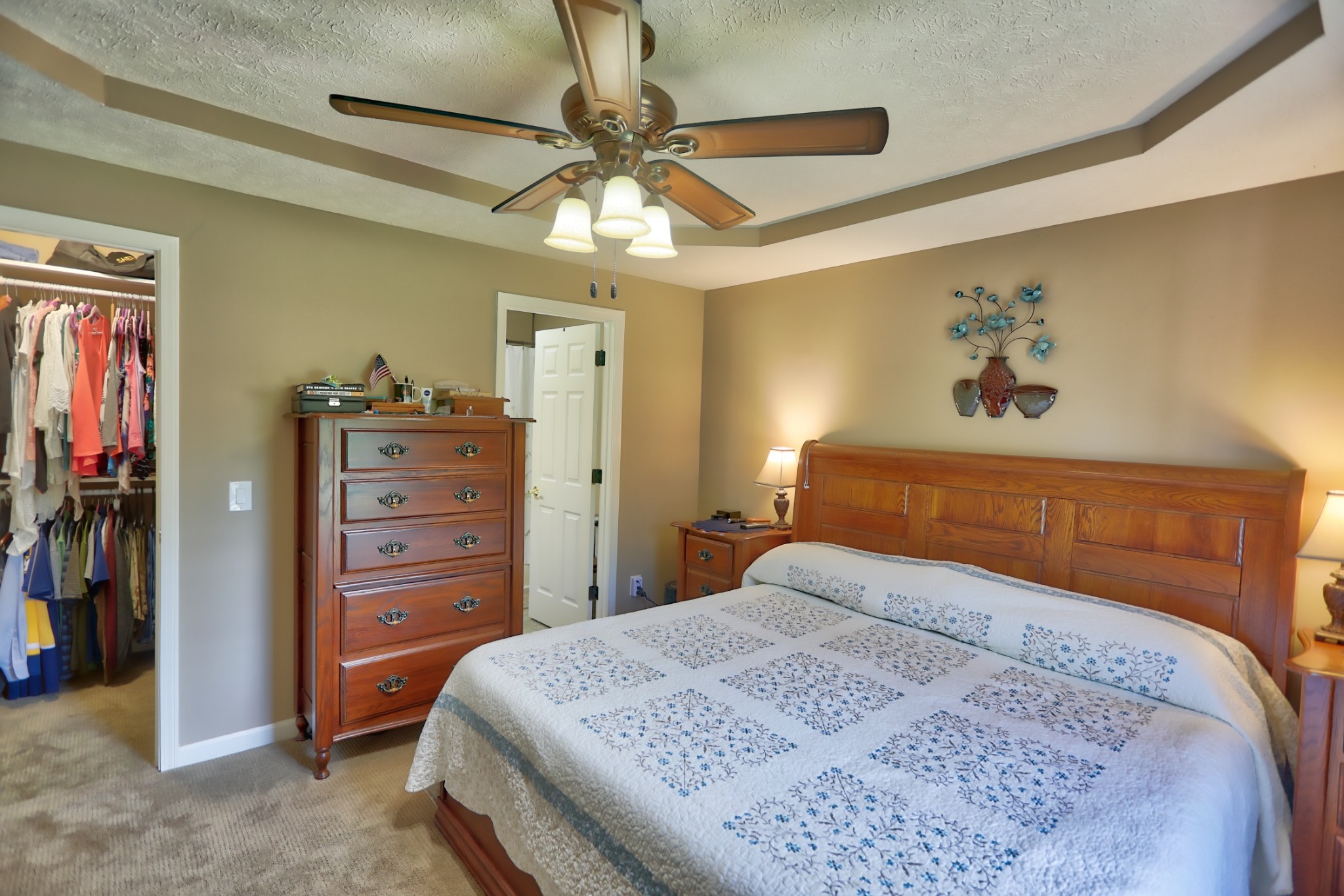 7696 South Swift Road Goodlettsville, TN 37072 - Photo 17 of 31 a bedroom with a bed and a chandelier
