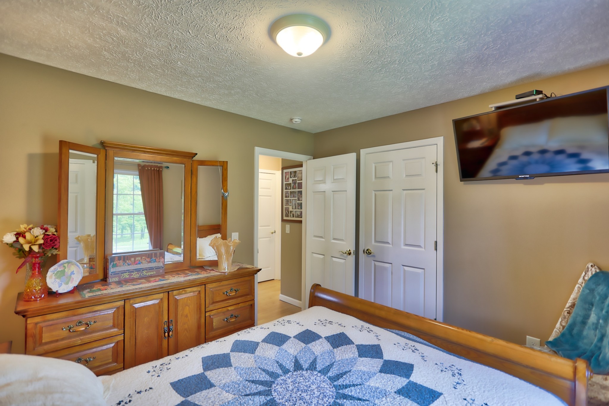 7696 South Swift Road Goodlettsville, TN 37072 - Photo 23 of 31 a spacious bedroom with a bed and a dresser