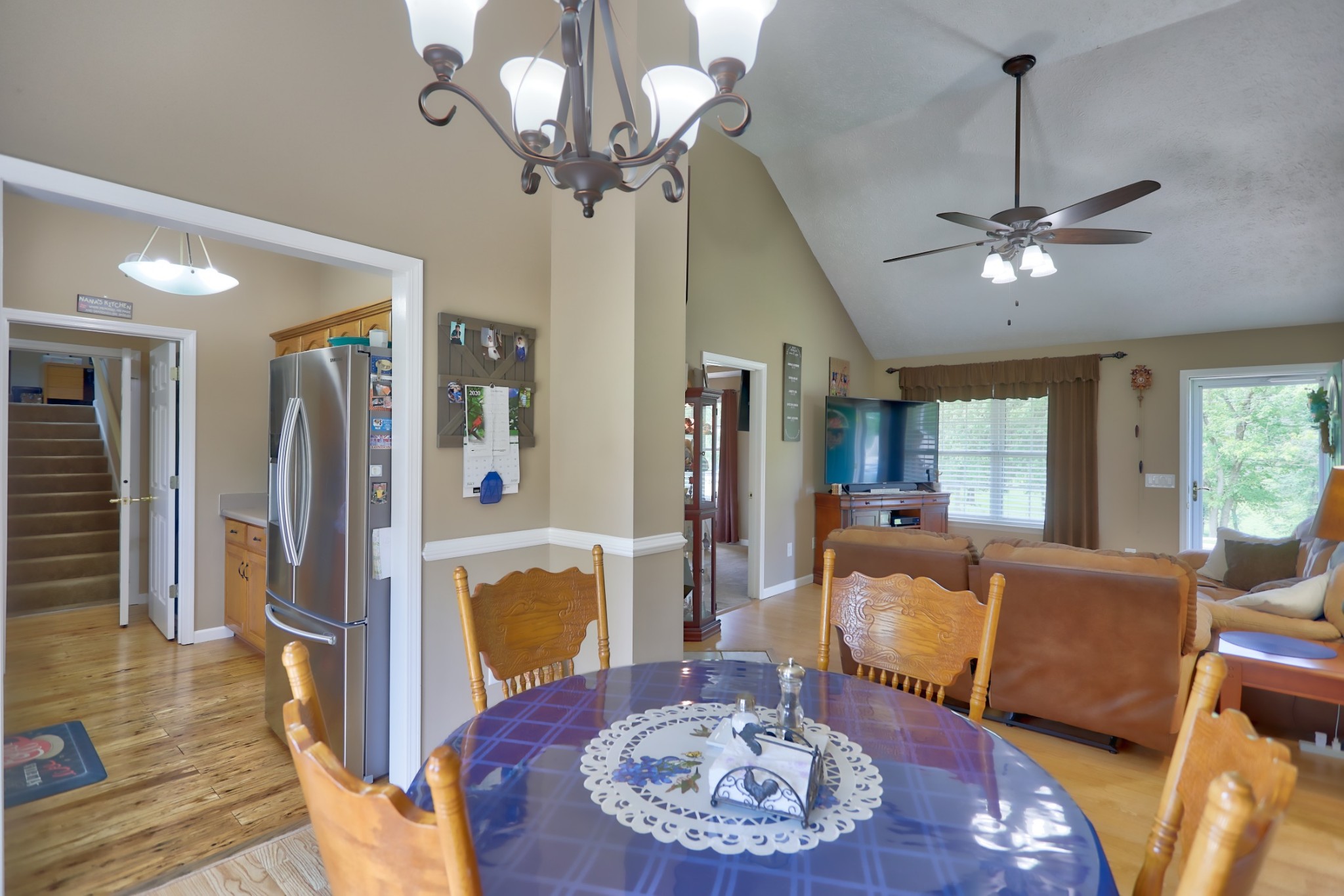 7696 South Swift Road Goodlettsville, TN 37072 - Photo 5 of 31 a living room with furniture a chandelier and a table