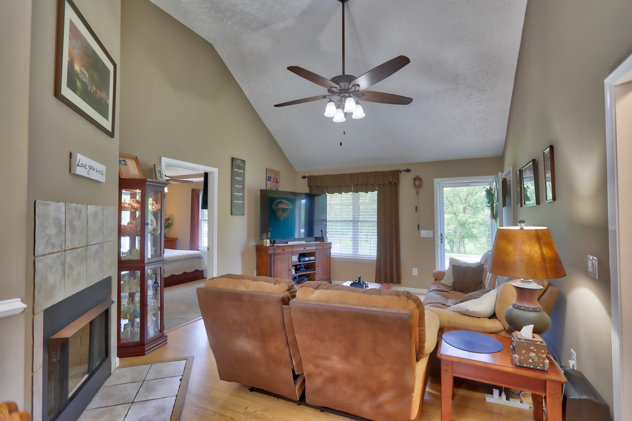 7696 South Swift Road Goodlettsville, TN 37072 - Photo 6 of 31 a living room with furniture a fireplace and a chandelier