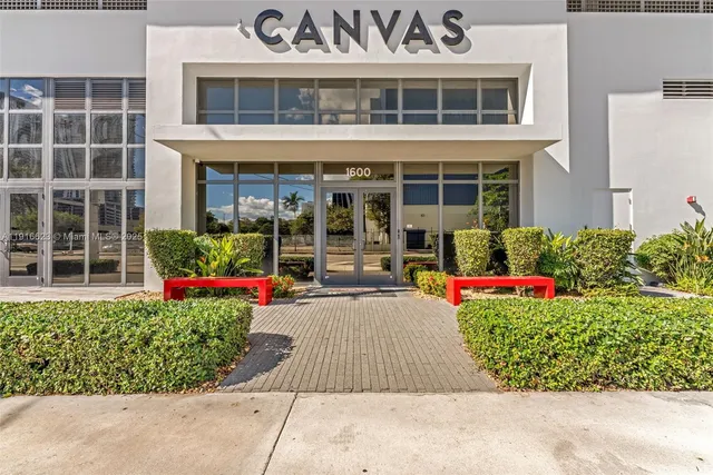 front view of a building with a garden