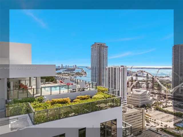 a view of a city with tall buildings