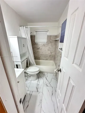 a bathroom with a sink and toilet