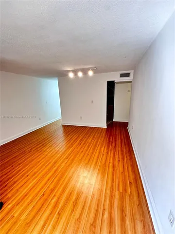 wooden floor in a hall with an entryway