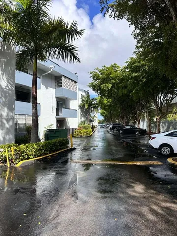 a view of swimming pool with outdoor seating and yard