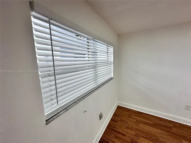 a view of a room that has a window in it
