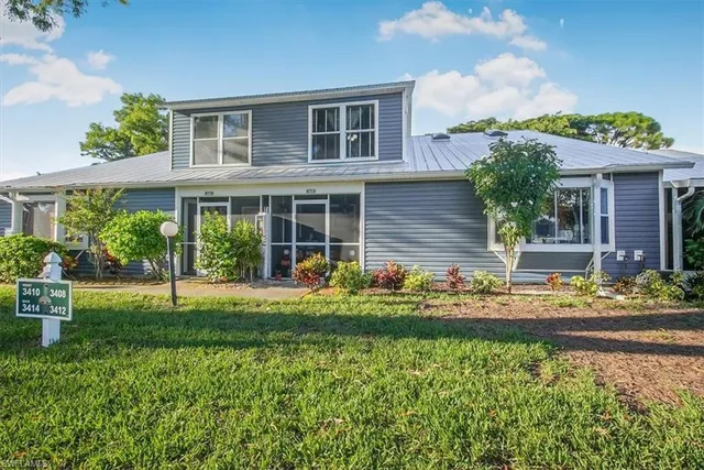 front view of a house with a yard