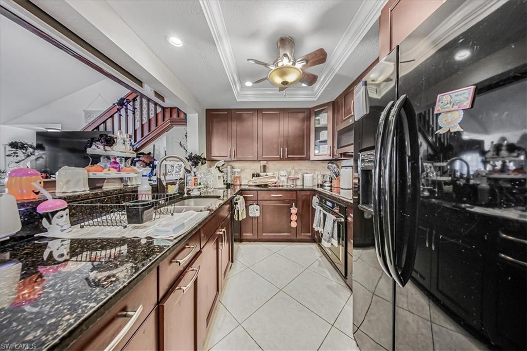 3408 Timberwood Circle, Unit 1360 Naples, FL 34105 - Photo 15 of 36 a kitchen with lots of counter top space