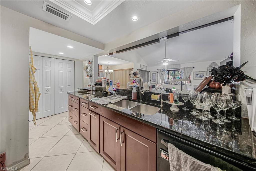 3408 Timberwood Circle, Unit 1360 Naples, FL 34105 - Photo 16 of 36 a kitchen with lots of counter top space