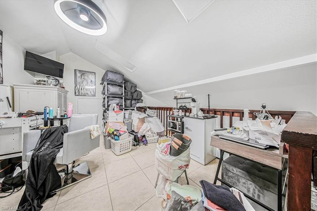 3408 Timberwood Circle, Unit 1360 Naples, FL 34105 - Photo 19 of 36 a view of a kitchen and dining room