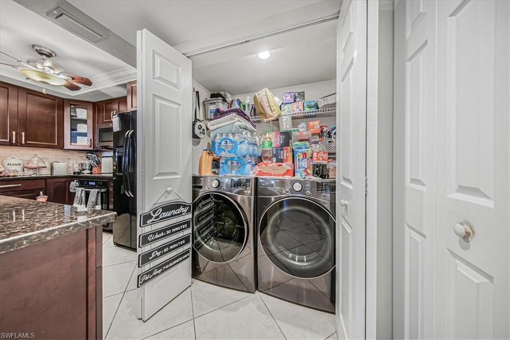 3408 Timberwood Circle, Unit 1360 Naples, FL 34105 - Photo 30 of 36 a view of a storage & utility room with washer and dryer