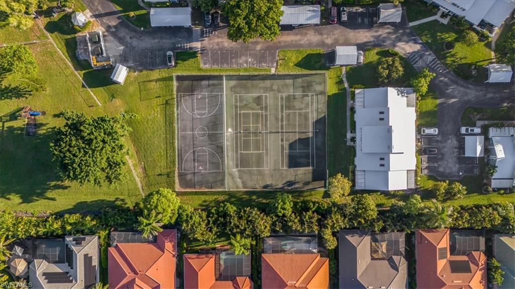 3408 Timberwood Circle, Unit 1360 Naples, FL 34105 - Photo 34 of 36 a front view of a house with a yard