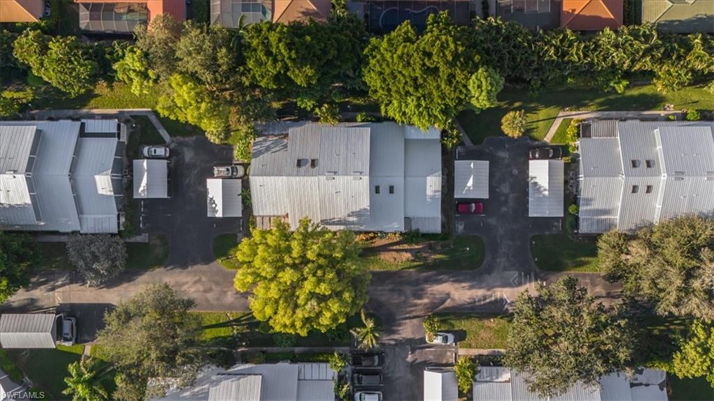 3408 Timberwood Circle, Unit 1360 Naples, FL 34105 - Photo 36 of 36 a backyard of a house with lots of green space