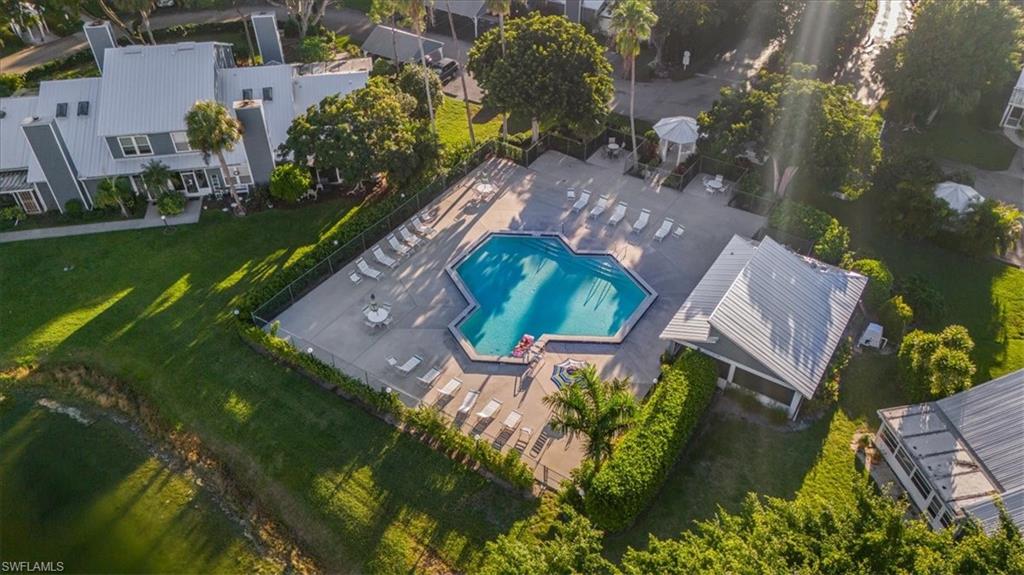 3408 Timberwood Circle, Unit 1360 Naples, FL 34105 - Photo 5 of 36 an aerial view of a house with garden space and street view
