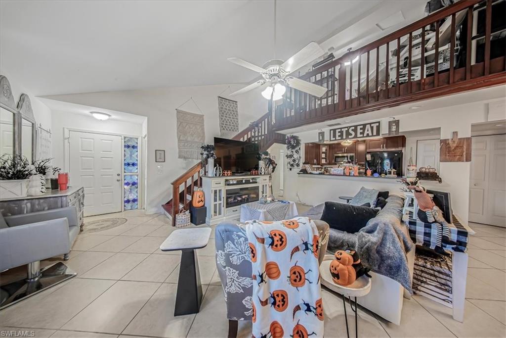 3408 Timberwood Circle, Unit 1360 Naples, FL 34105 - Photo 8 of 36 a living room with furniture and wooden floor