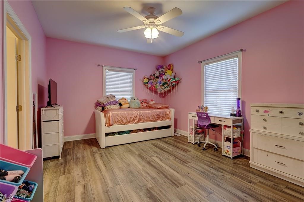 3079 Alexander Road Atwater, OH 44201 - Photo 16 of 45 Bedroom featuring light wood-style flooring and a ceiling fan