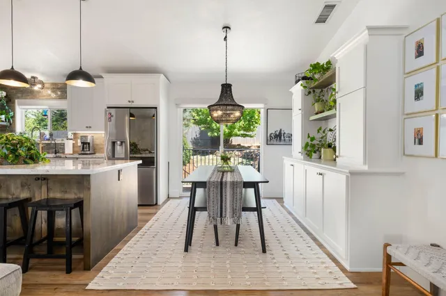 a kitchen with a stove and a white counter top