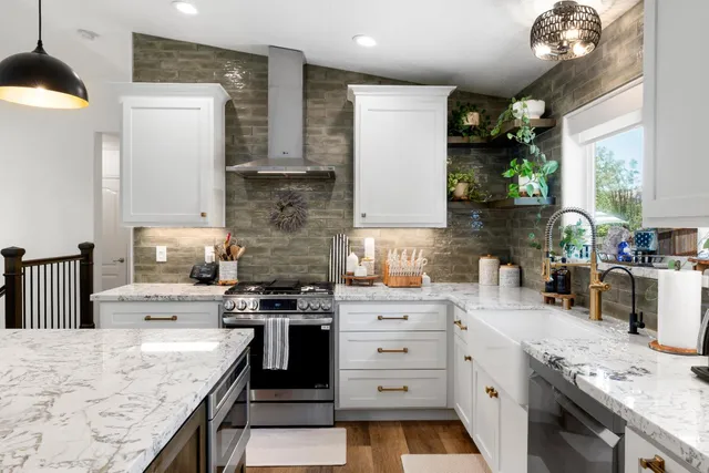 a kitchen with stainless steel appliances kitchen island a large island in the center and wooden floor