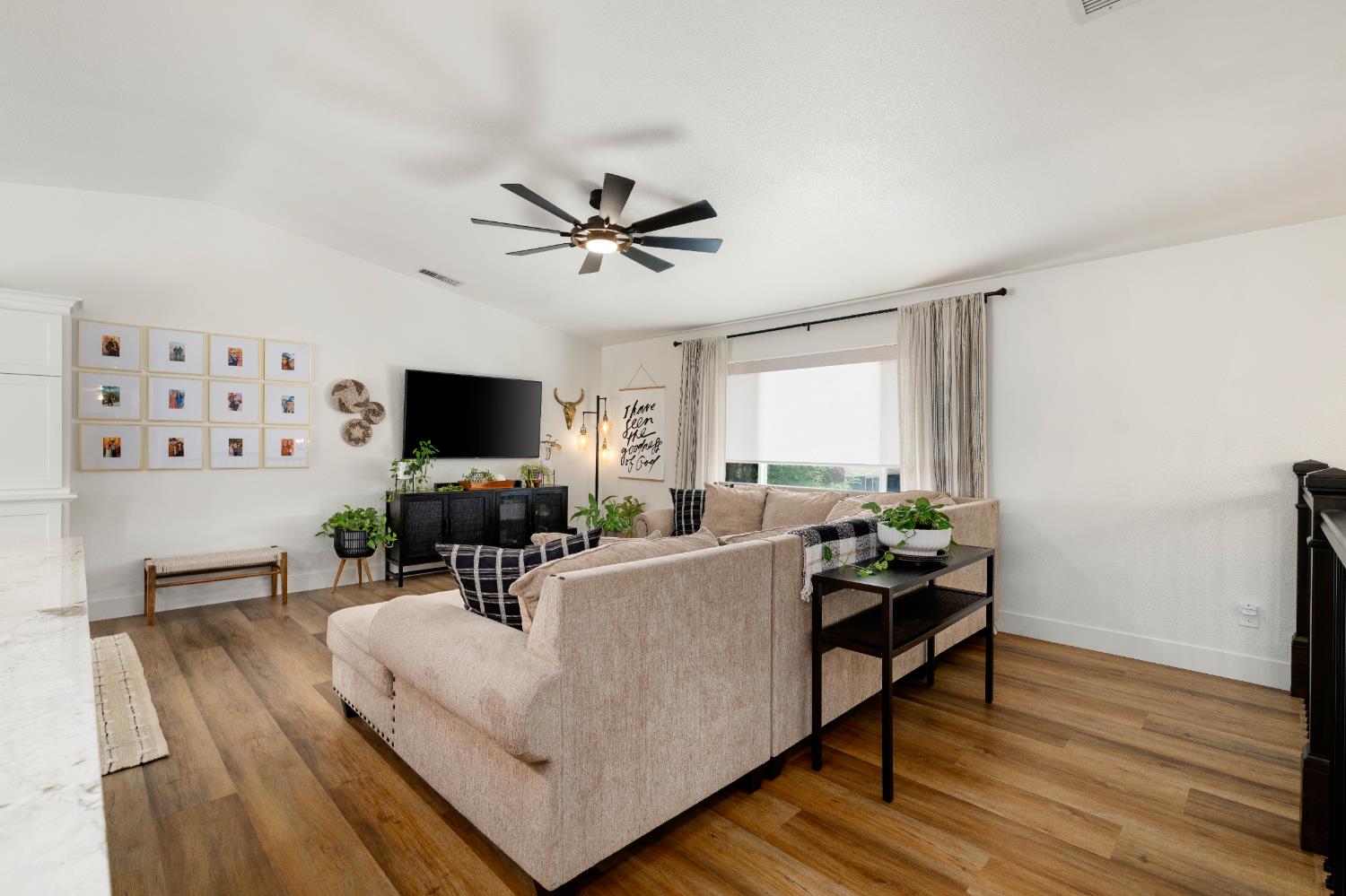 1130 Summer Ridge Court Auburn, CA 95603 - Photo 20 of 56 a living room with furniture a flat screen tv and a fireplace