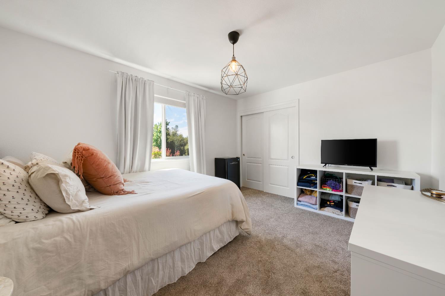 1130 Summer Ridge Court Auburn, CA 95603 - Photo 26 of 56 a bedroom with a bed and a flat screen tv