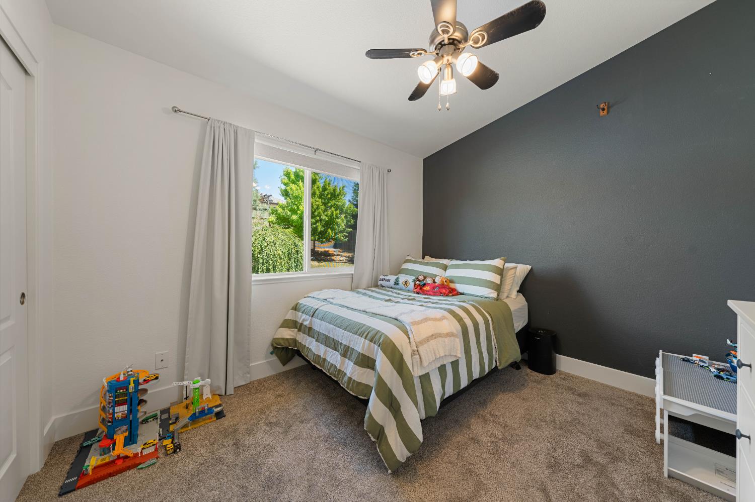 1130 Summer Ridge Court Auburn, CA 95603 - Photo 28 of 56 a bedroom with a bed and a chandelier