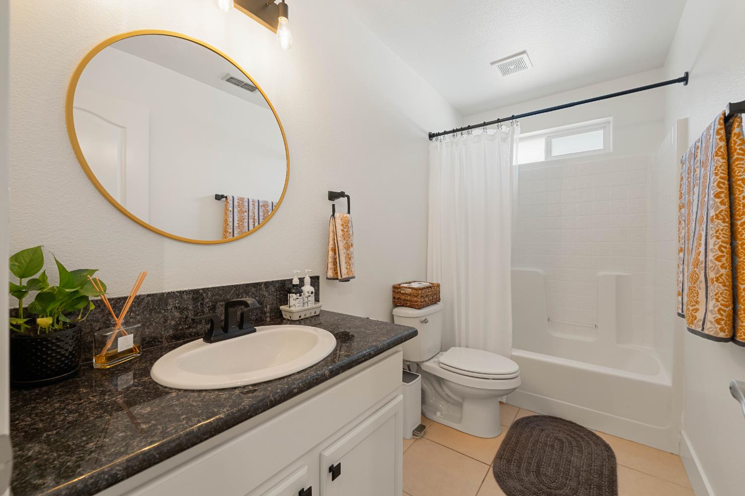 1130 Summer Ridge Court Auburn, CA 95603 - Photo 30 of 56 a bathroom with a granite countertop sink mirror and toilet