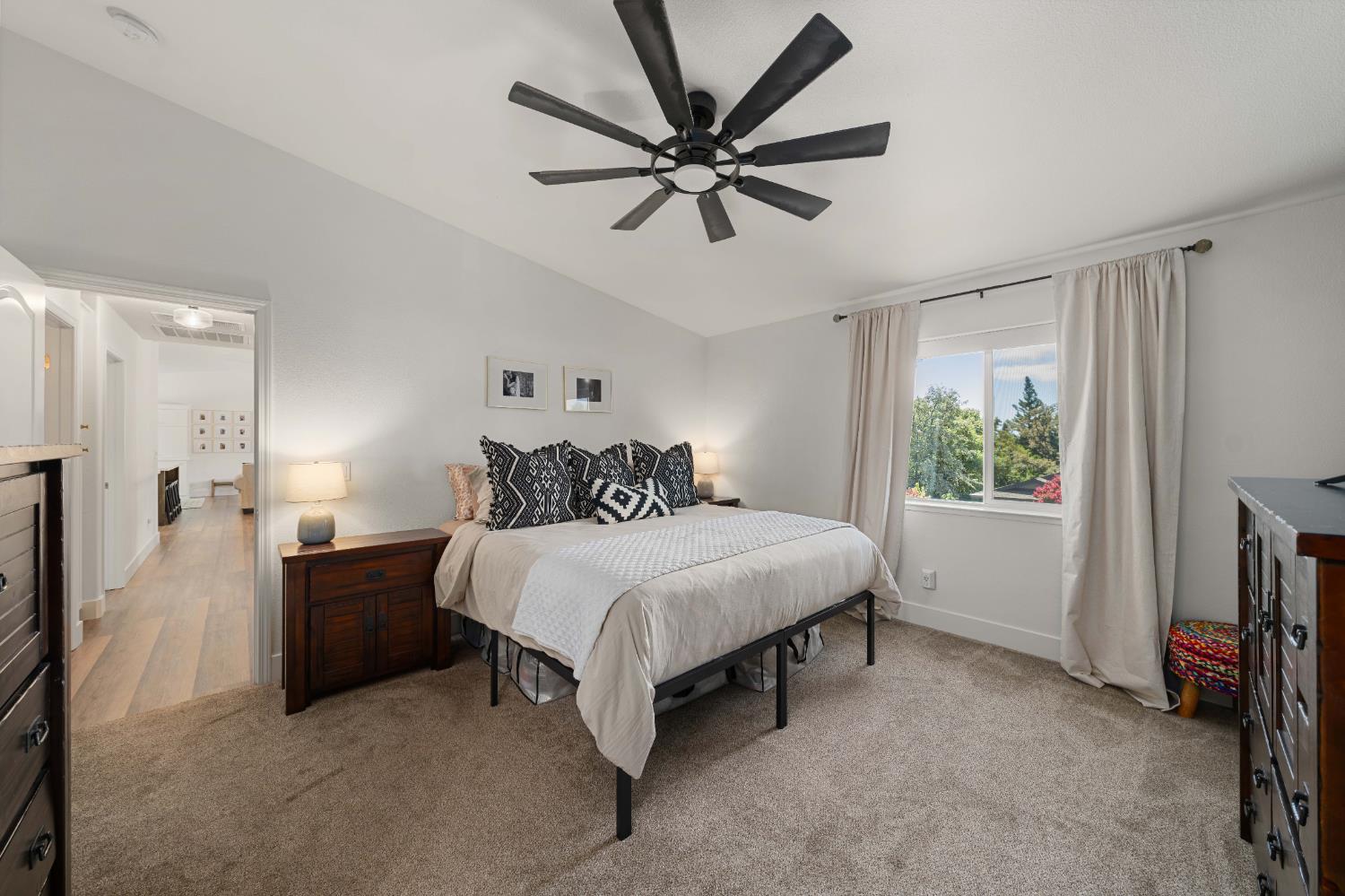 1130 Summer Ridge Court Auburn, CA 95603 - Photo 32 of 56 a bedroom with a bed and a chandelier