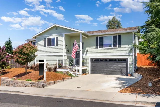 a front view of a house with yard