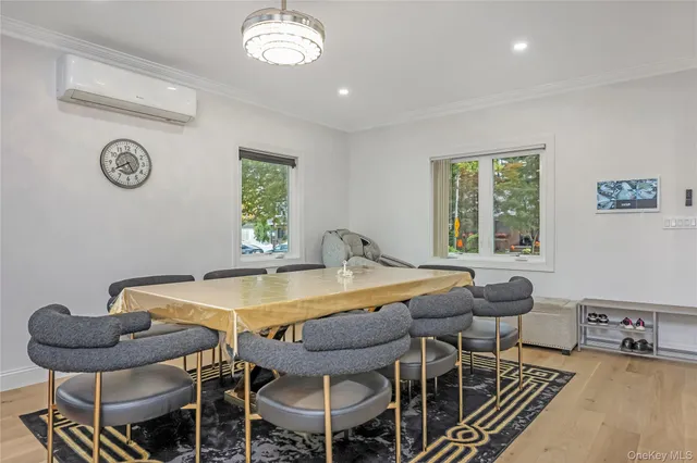 a view of a dining room with furniture and chandelier