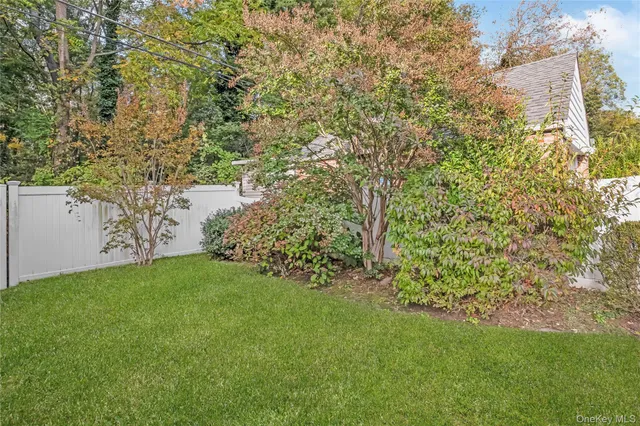 a view of a yard with a tree