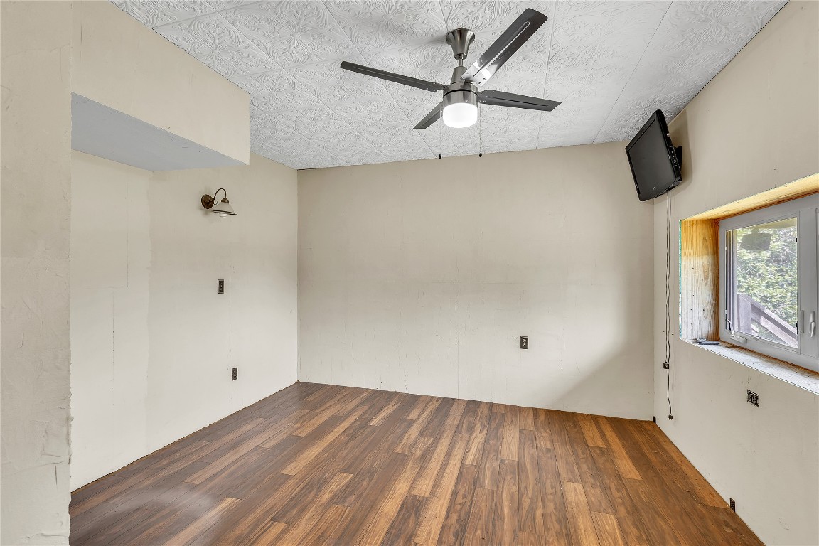 1228 Stanton Ranch Loop Johnson City, TX 78636 - Photo 11 of 17 wooden floor in an empty room with a window