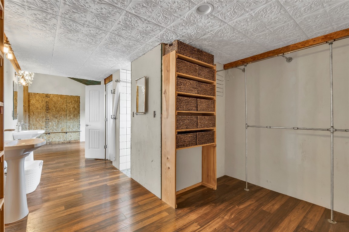 1228 Stanton Ranch Loop Johnson City, TX 78636 - Photo 16 of 17 a view of a hallway with wooden floor and closet
