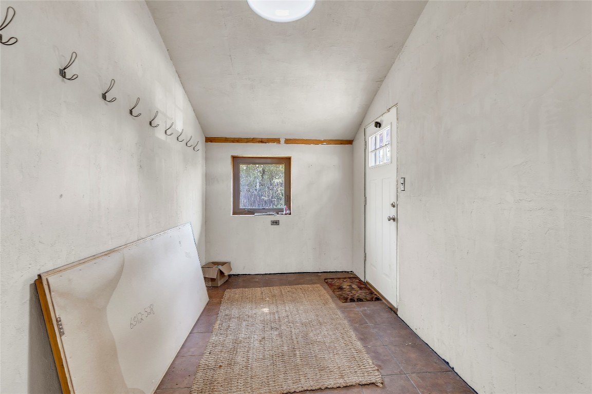 1228 Stanton Ranch Loop Johnson City, TX 78636 - Photo 2 of 17 a view of an entryway with wooden floor