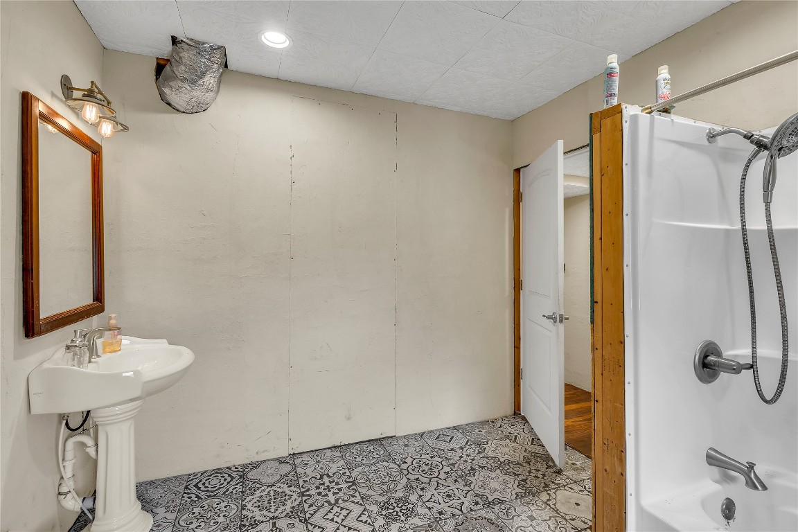 1228 Stanton Ranch Loop Johnson City, TX 78636 - Photo 10 of 17 a bathroom with a shower and a sink