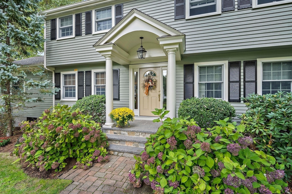 21 Old Coach Road Canton, MA 02021 - Photo 1 of 42 a front view of a house with a lots of yellow lighting