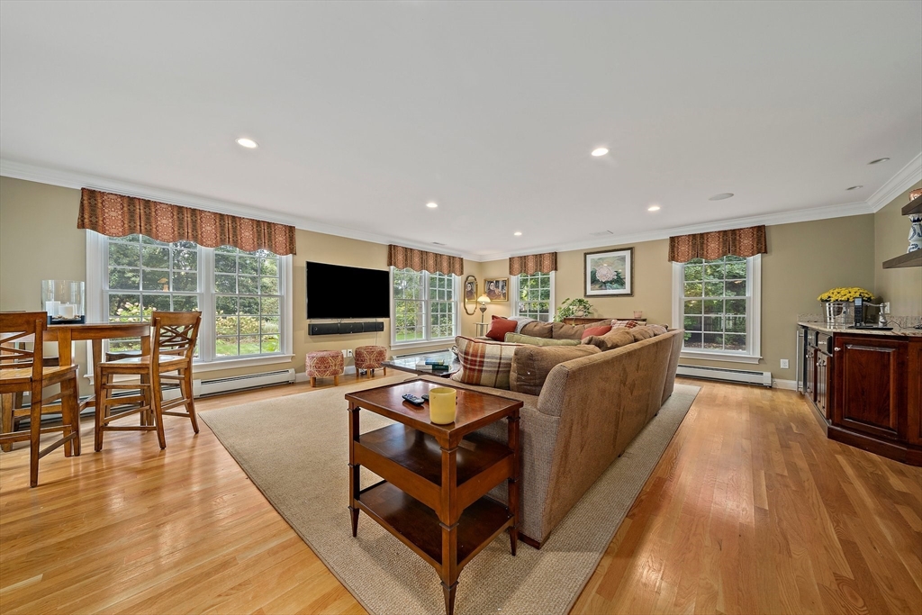 21 Old Coach Road Canton, MA 02021 - Photo 11 of 42 a living room with furniture wooden floor and a flat screen tv