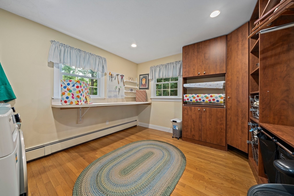 21 Old Coach Road Canton, MA 02021 - Photo 15 of 42 a view of a kitchen with fridge and wooden floor