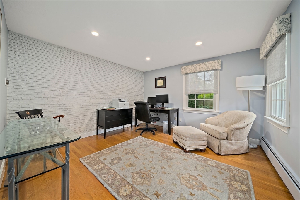 21 Old Coach Road Canton, MA 02021 - Photo 16 of 42 a living room with furniture and a table