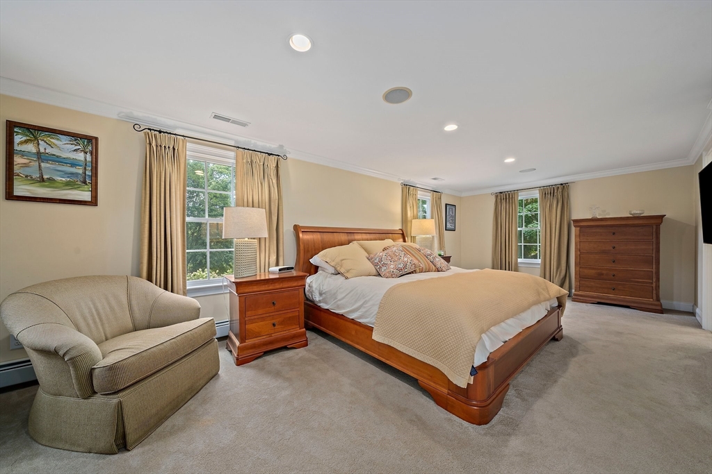 21 Old Coach Road Canton, MA 02021 - Photo 18 of 42 a spacious bedroom with a bed and a couch