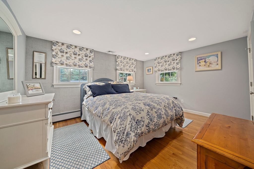 21 Old Coach Road Canton, MA 02021 - Photo 23 of 42 a bedroom with a bed and a night stand