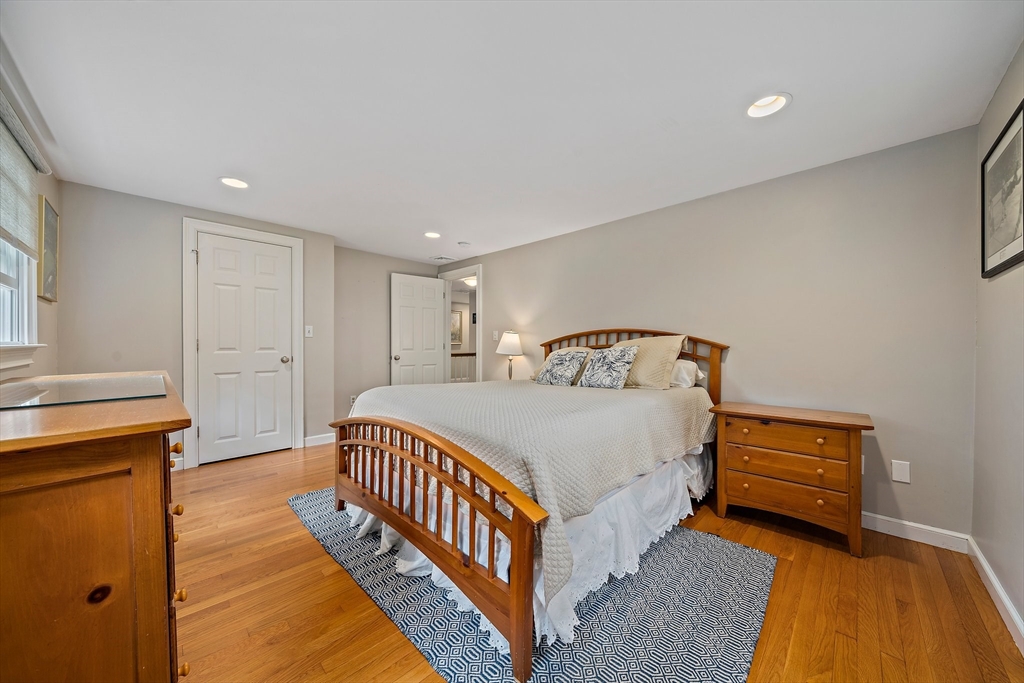 21 Old Coach Road Canton, MA 02021 - Photo 26 of 42 a bedroom with a bed and a night stand