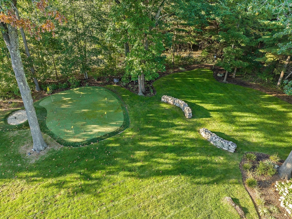 21 Old Coach Road Canton, MA 02021 - Photo 34 of 42 a backyard of a house with lots of green space