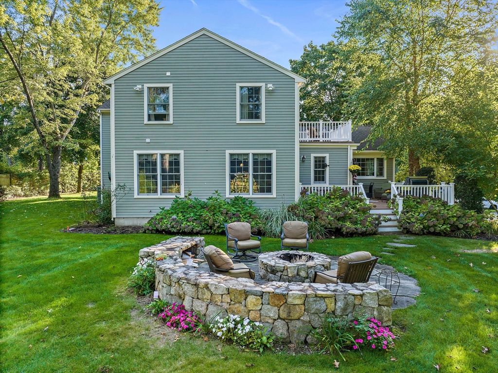 21 Old Coach Road Canton, MA 02021 - Photo 37 of 42 a front view of house with yard and outdoor seating