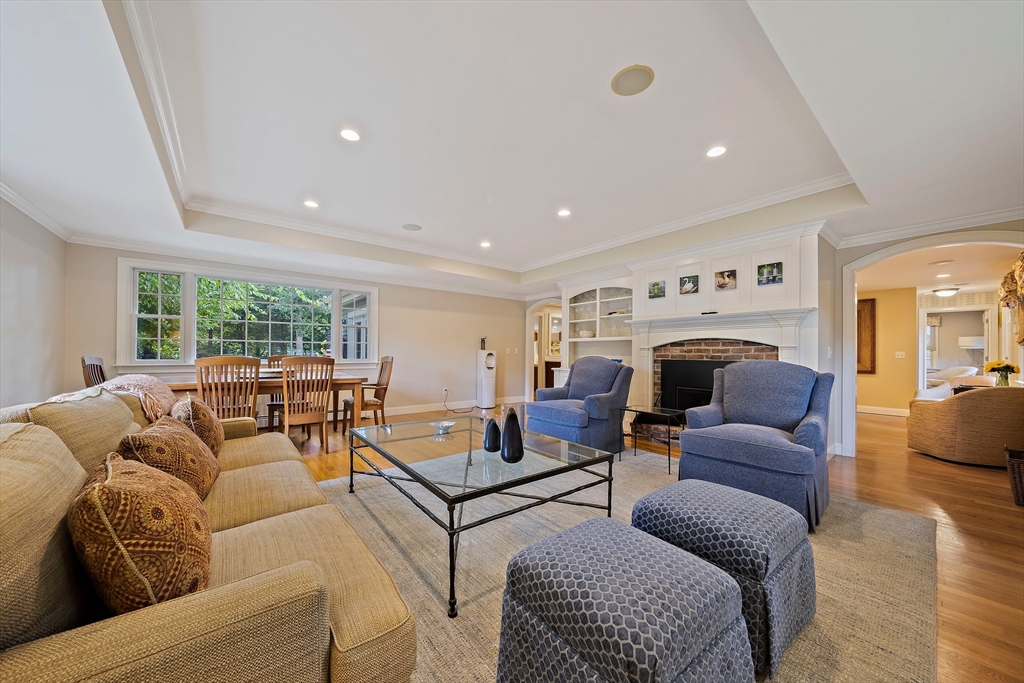 21 Old Coach Road Canton, MA 02021 - Photo 7 of 42 a living room with furniture a large window and a fireplace