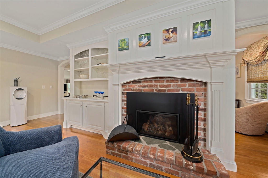 21 Old Coach Road Canton, MA 02021 - Photo 8 of 42 a living room with furniture and a fireplace