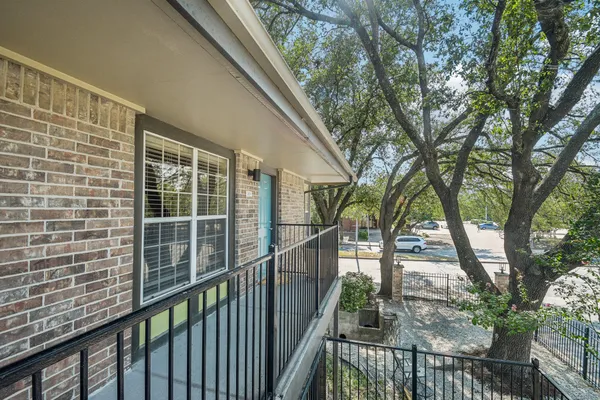 a view of a balcony with an outdoor space