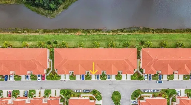 an aerial view of residential houses with outdoor space and street view