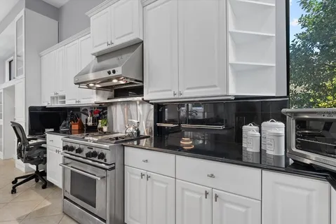 a workspace with furniture and a window