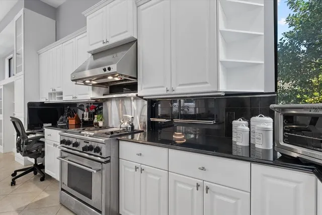 a workspace with furniture and a window