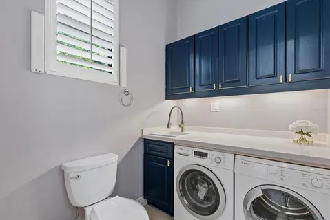 a living room with furniture ceiling fan and a window